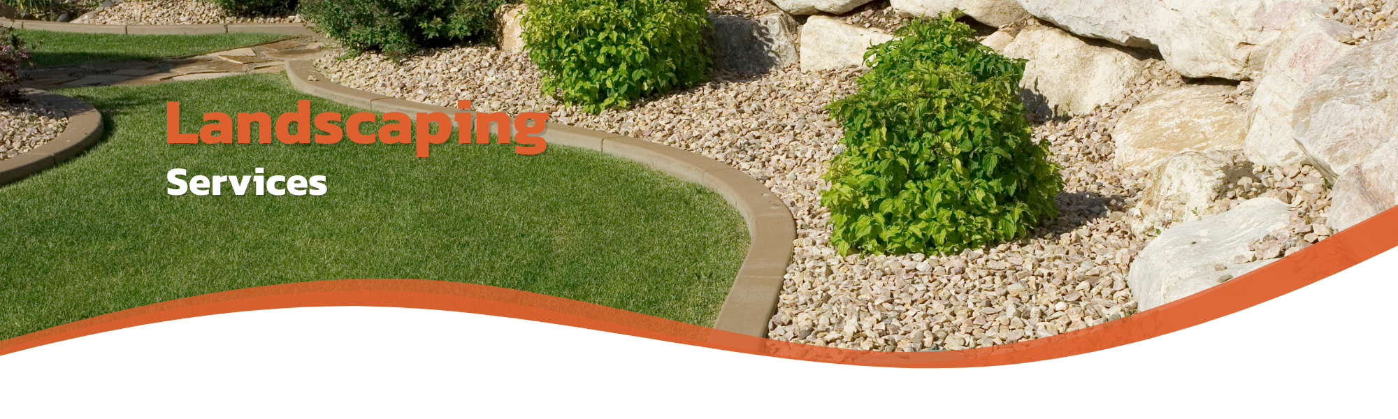 landscaped flower bed with river rocks